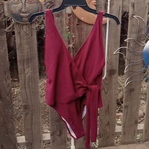 Woman's swim suit one piece. Maroon, new with tags. Size medium.